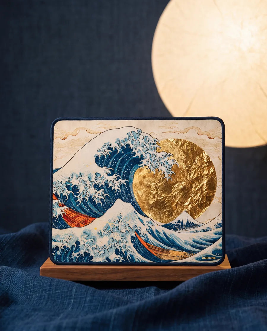 The lint-free cloth on a wooden stand, printed with the Great Wave and a gold-leaf sun, under a paper lantern moon