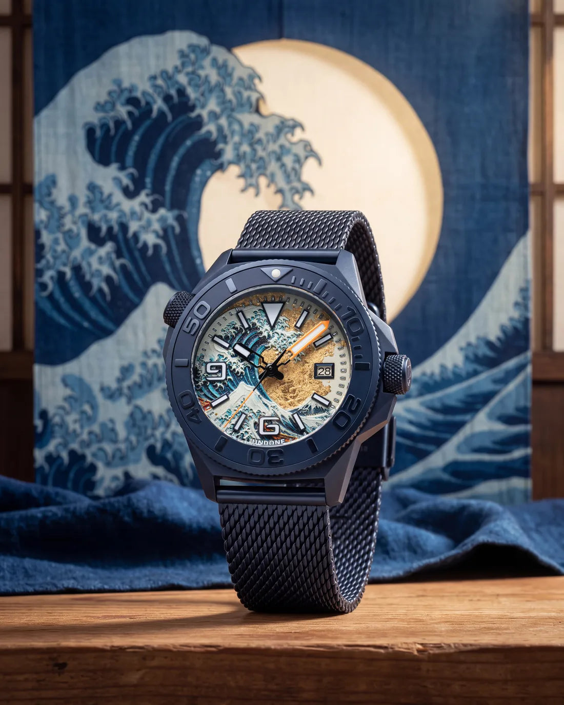 Hokusai II on its blue mesh strap, standing before an indigo Great Wave hanging and a full moon